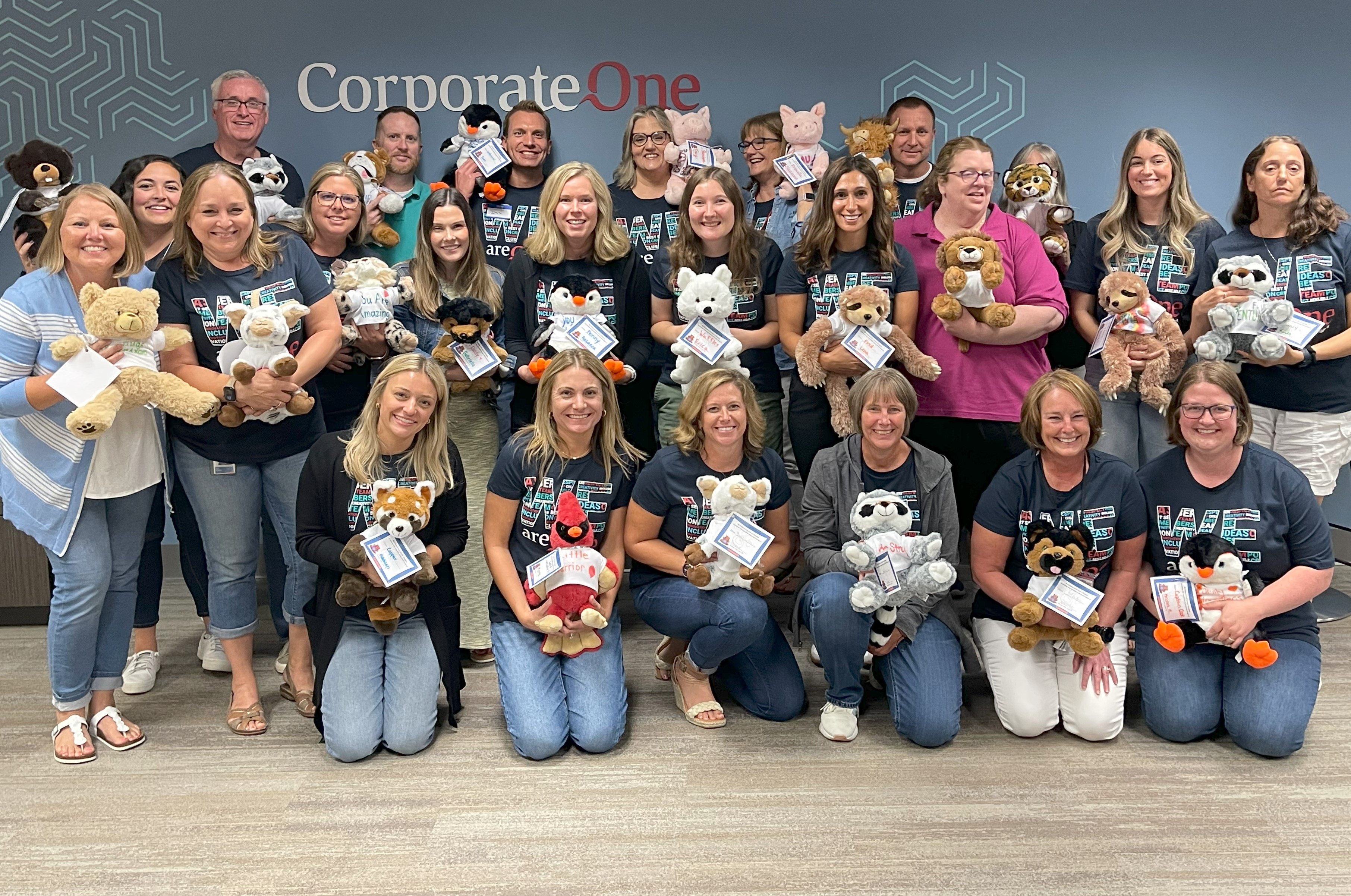 Staff members display finished Comfort Buddies